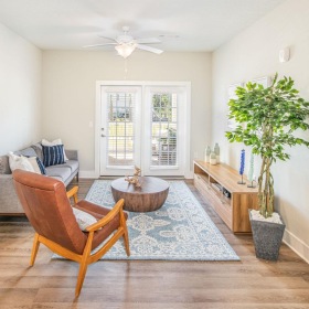 a living room with a chair and a couch